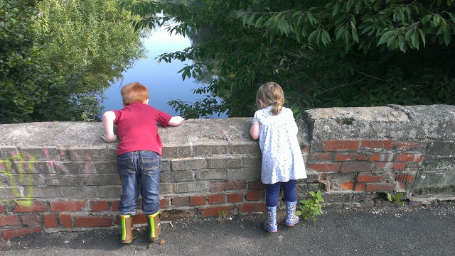Children playing pooh sticks