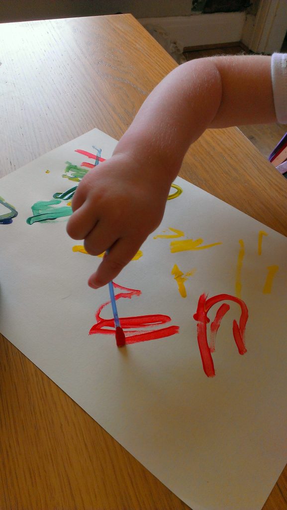 mark making with cotton buds and red poster paint