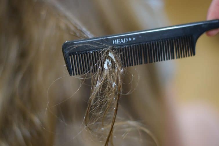 Gently comb the blue tack from the lengths of the hair