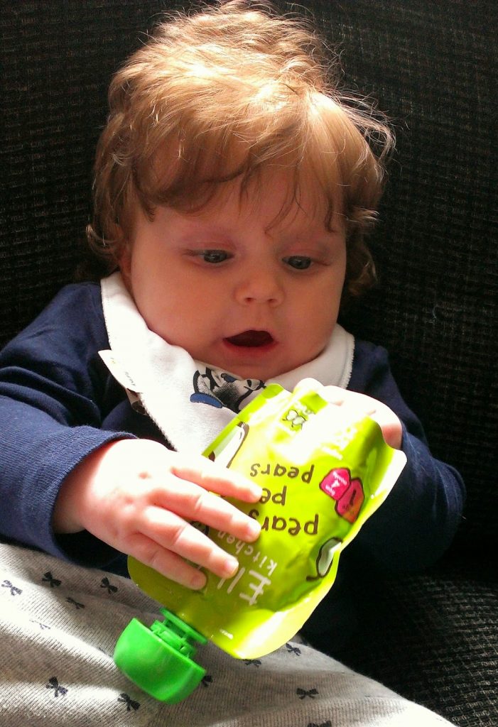 Baby play with Ella's Kitchen pouch