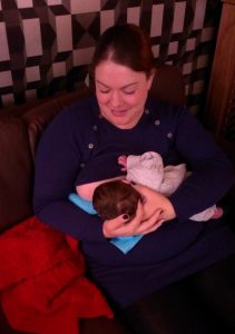 Mother breastfeeding newborn baby