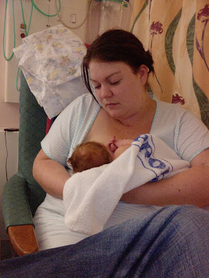 Mummy breastfeeding newborn son