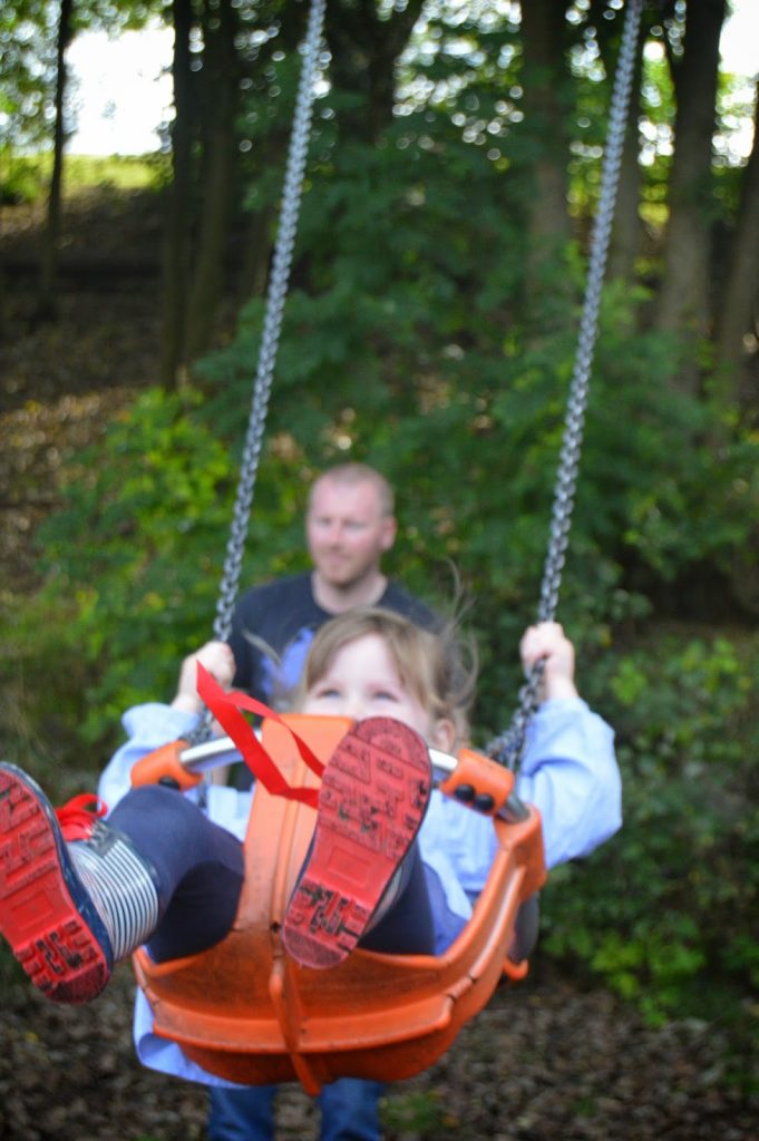 little girl on swing