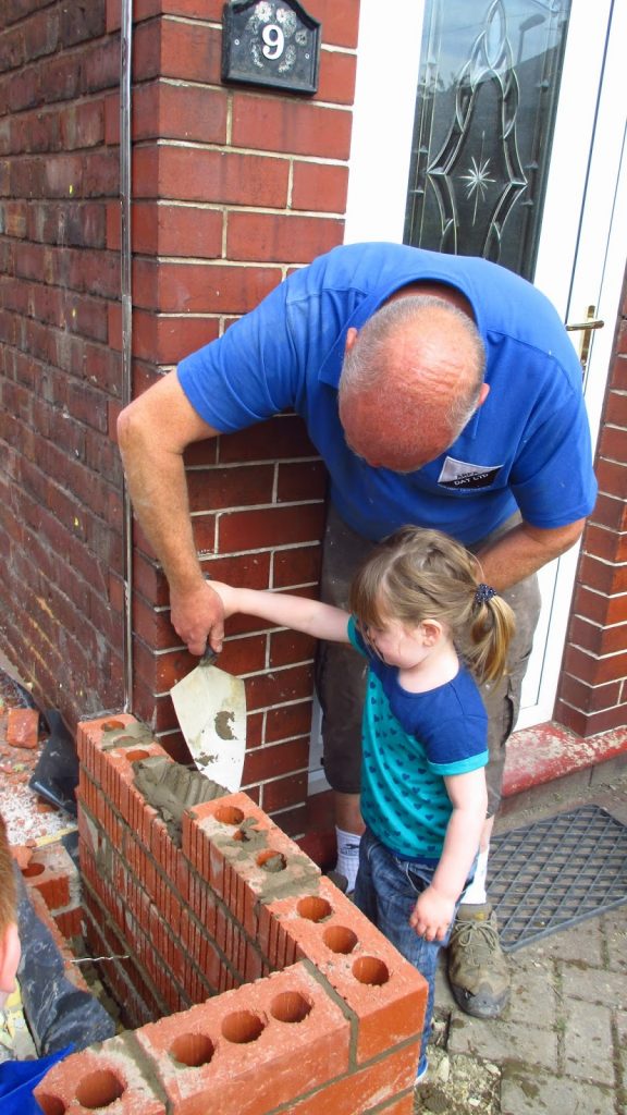 Chloe and Grandad doing the mortar together