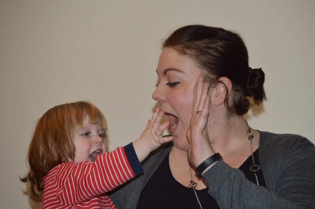 15 month old Amy high fiving mummy