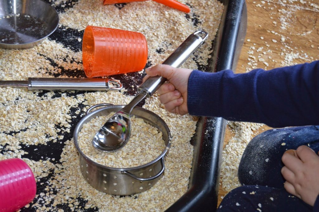 mixing oats in a pan - tuff spot