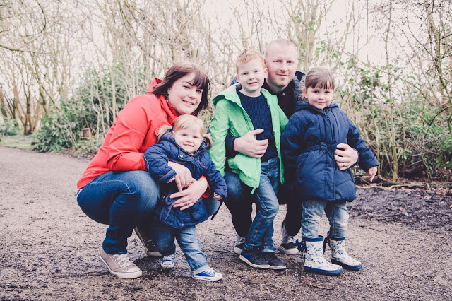 Family of five wearing brightly coloured coats in Heaton Park - photographed by Sally Langstaff