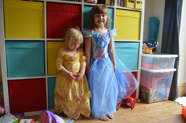 Girls wearing Disney princess dresses
