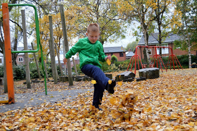 Kicking leaves in Muddy Puddles waterproof trousers