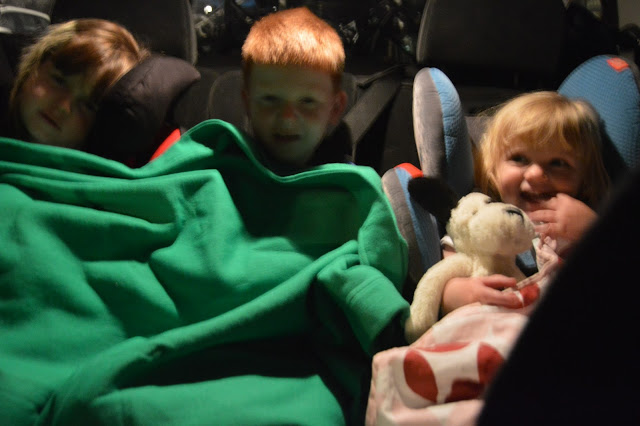 Kids in the back of the car, travelling at night