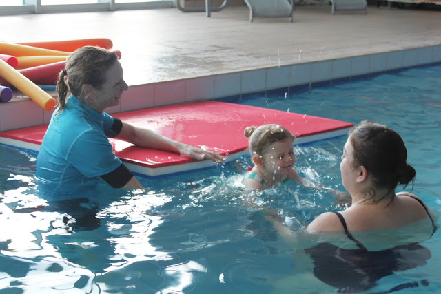 Amy jumping in off the float in her Puddle Ducks Kickers lesson
