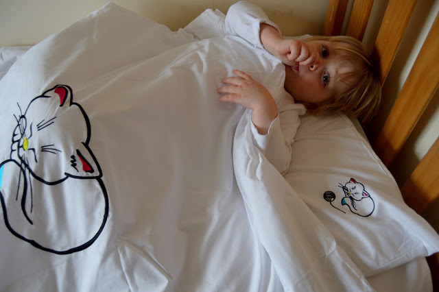 toddler in bed with Tuck N' Snug bedding toddler in bed with Tuck N' Snug bedding