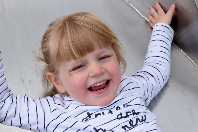 Toddler showing of a mouth full of milk teeth