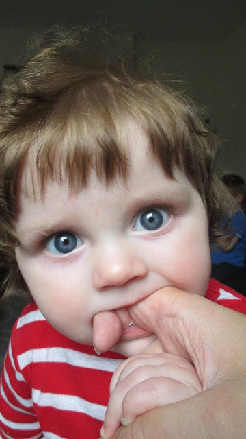 Teething baby chewing on Mummy's finger - Nelson's Teetha