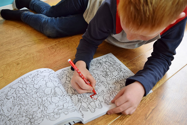 boy colouring in with felt tip