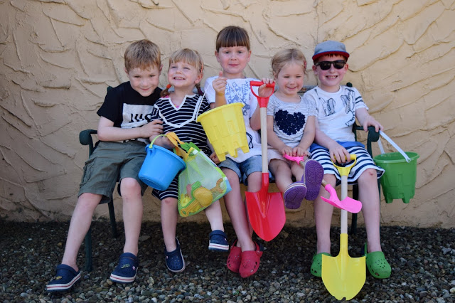 kids with buckets and spades
