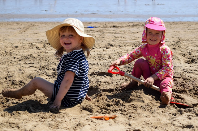 girls playing in the sand