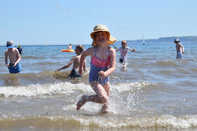 girl splashing in the sea