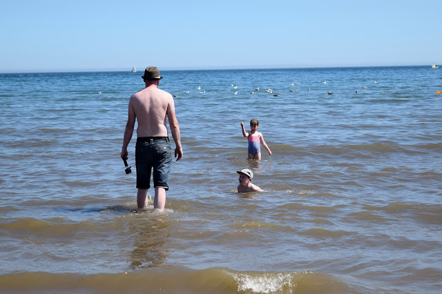 Dad paddling with children