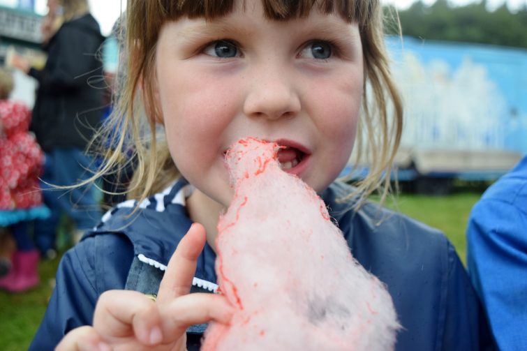 girl eating candy floss