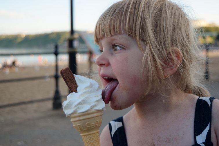 Toddler with ice cream on the beach