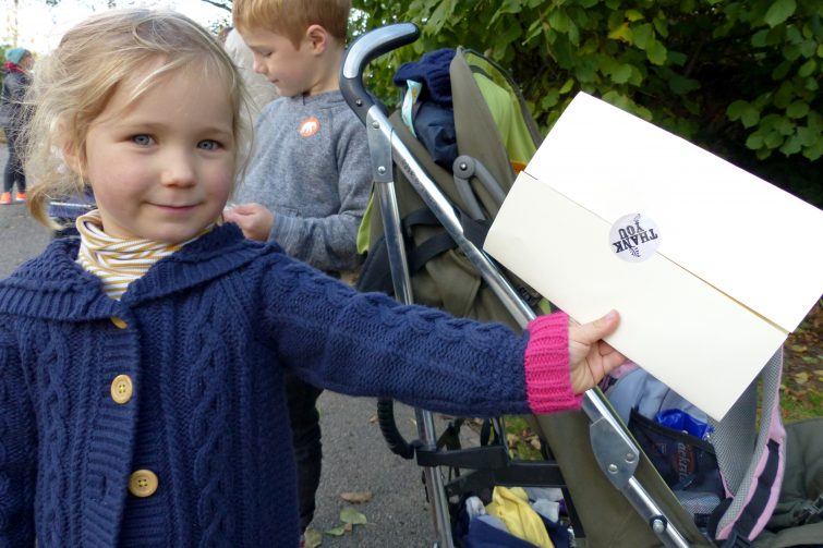Erin shows her thank you message from the owls - The Enchantment of Chester Zoo
