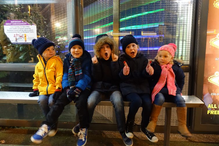 Kids waiting for the tram in Blackpool for the illuminations