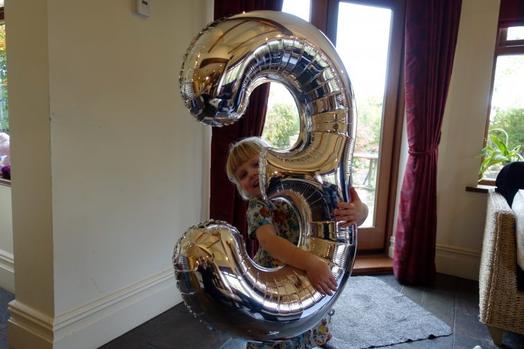 Amy with three helium balloon from hobbycraft