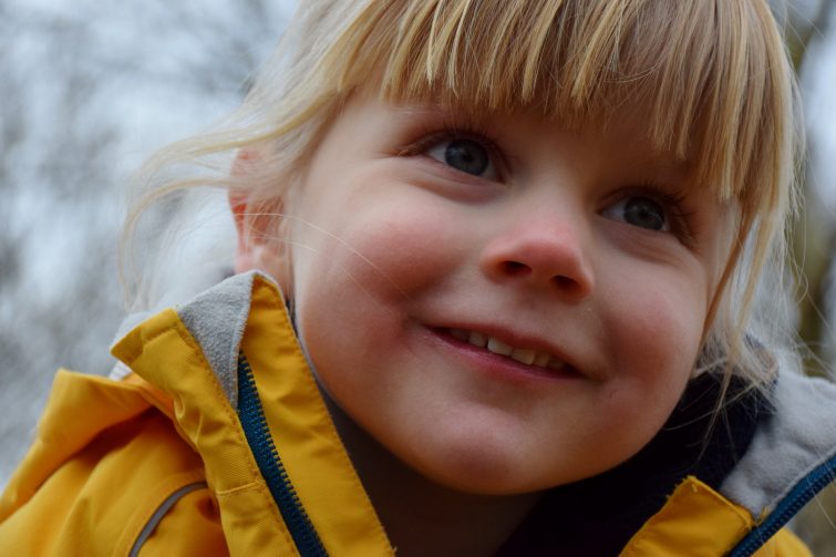 Little girl with blonde fringe and blue eyes - still needs her afternoon sleeps