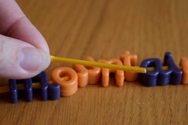 The yellow laces have a long tip - Learning Resources Lacing Letters