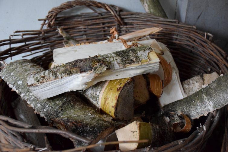 A full basket of freshly chopped wood for the open fire