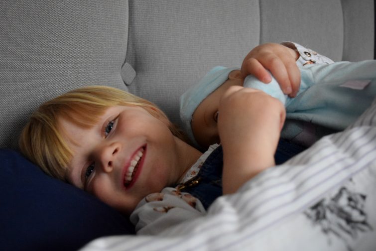 Baby Annabell's brother in bed with toddler
