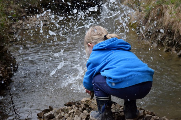 Throwing rocks in the stream