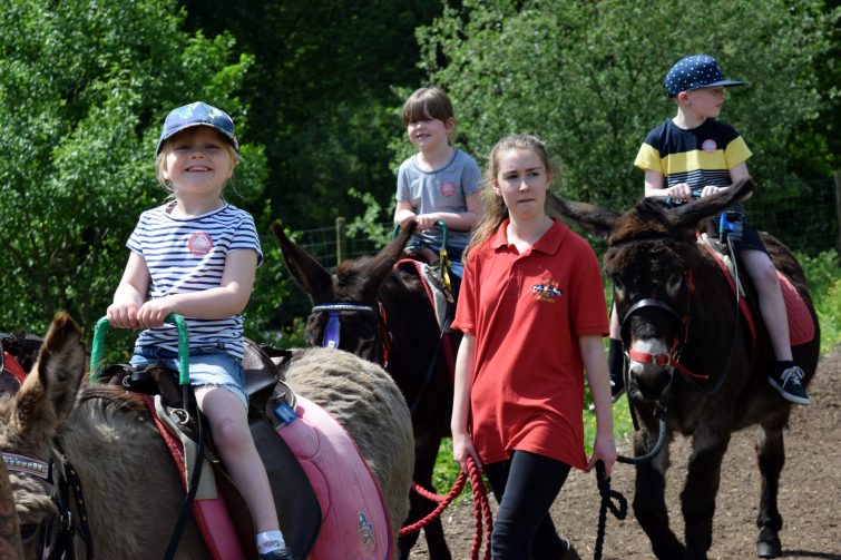 Riding donkeys at Smithills Open Farm with Piri Allergy