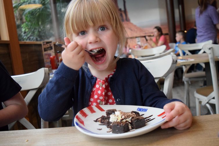 Enjoying a kids dessert at Huck's American Bar & Grill at Center Parcs Whinfell Forest