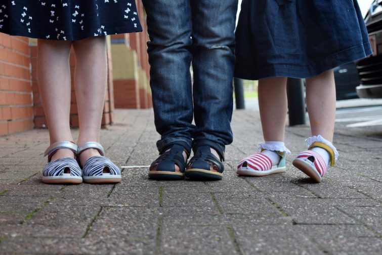 Kids wearing Bobux sandals