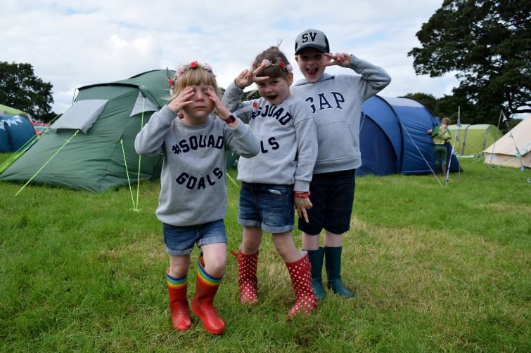 Camping at a festival with kids - use a windbreak to mark out your territory!