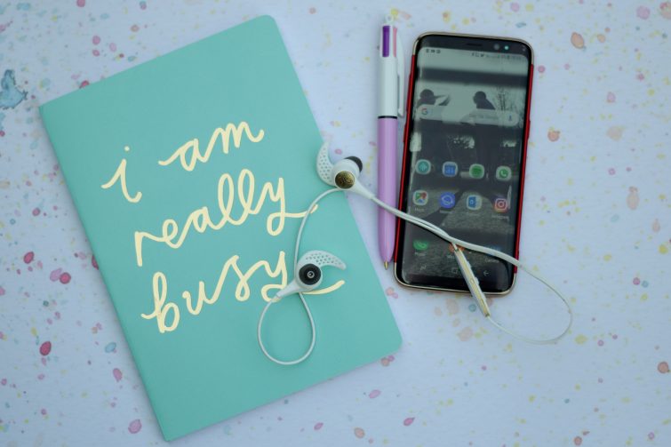 Jaybird X3 wireless headphones with mobile phone and notebook
