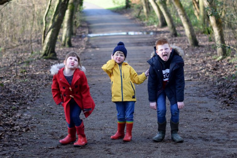 Siblings pulling silly faces