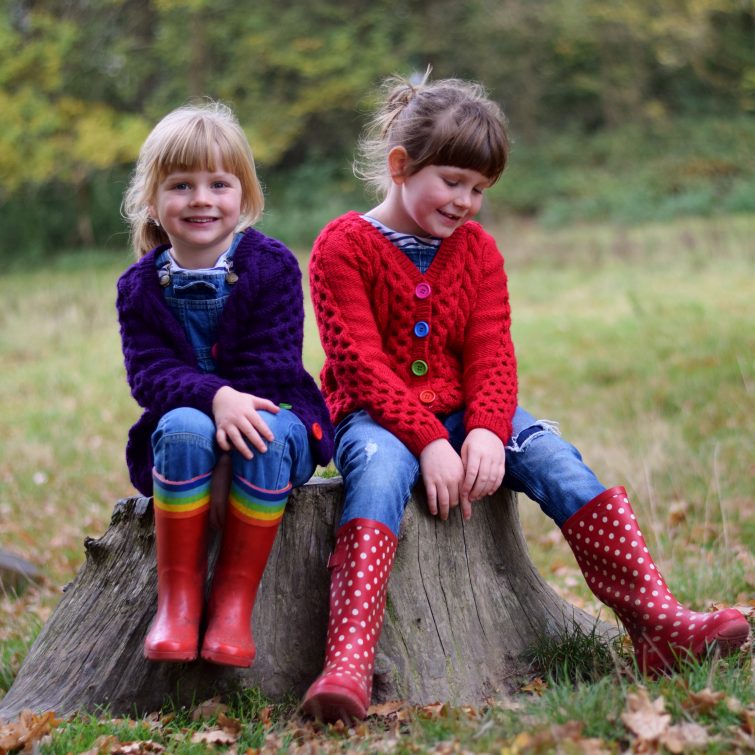 Girls in hand knitted cardigans