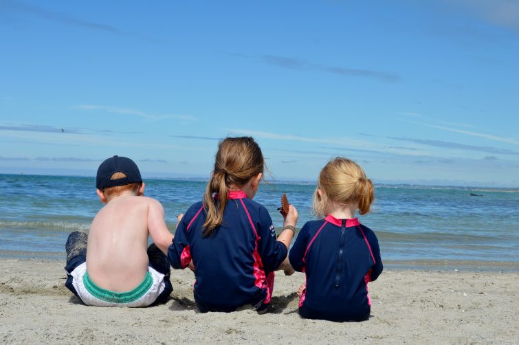 Kids on the beach in France- blue sky