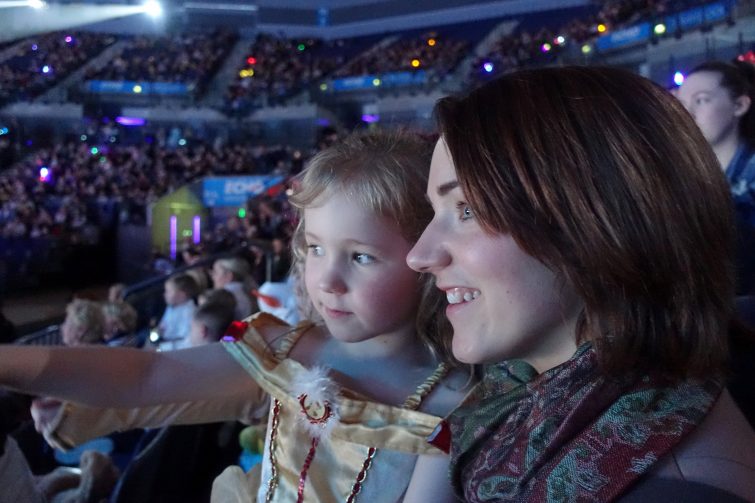 Mother and daughter watching Disney on Ice, Worlds of Enchantment