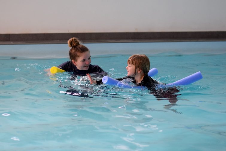 Puddle Ducks Swim Academy Pyjama Week - Swimming on woggles