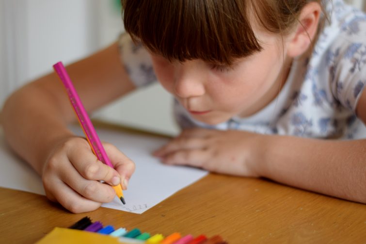 Little girl drawing for Bic Kids Artists
