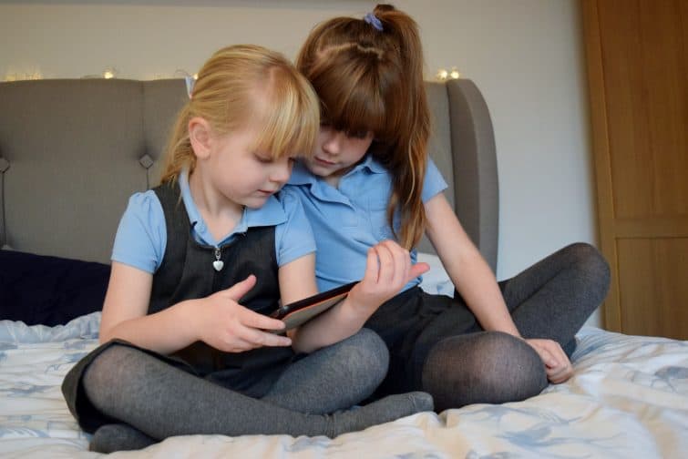 Girls watching a film on tablet