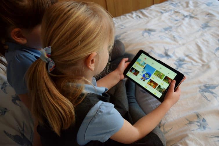 Girls using cbeebies app on tablet