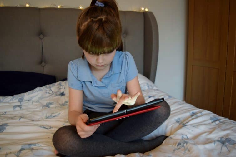 girl using tablet - Plusnet Nice Device