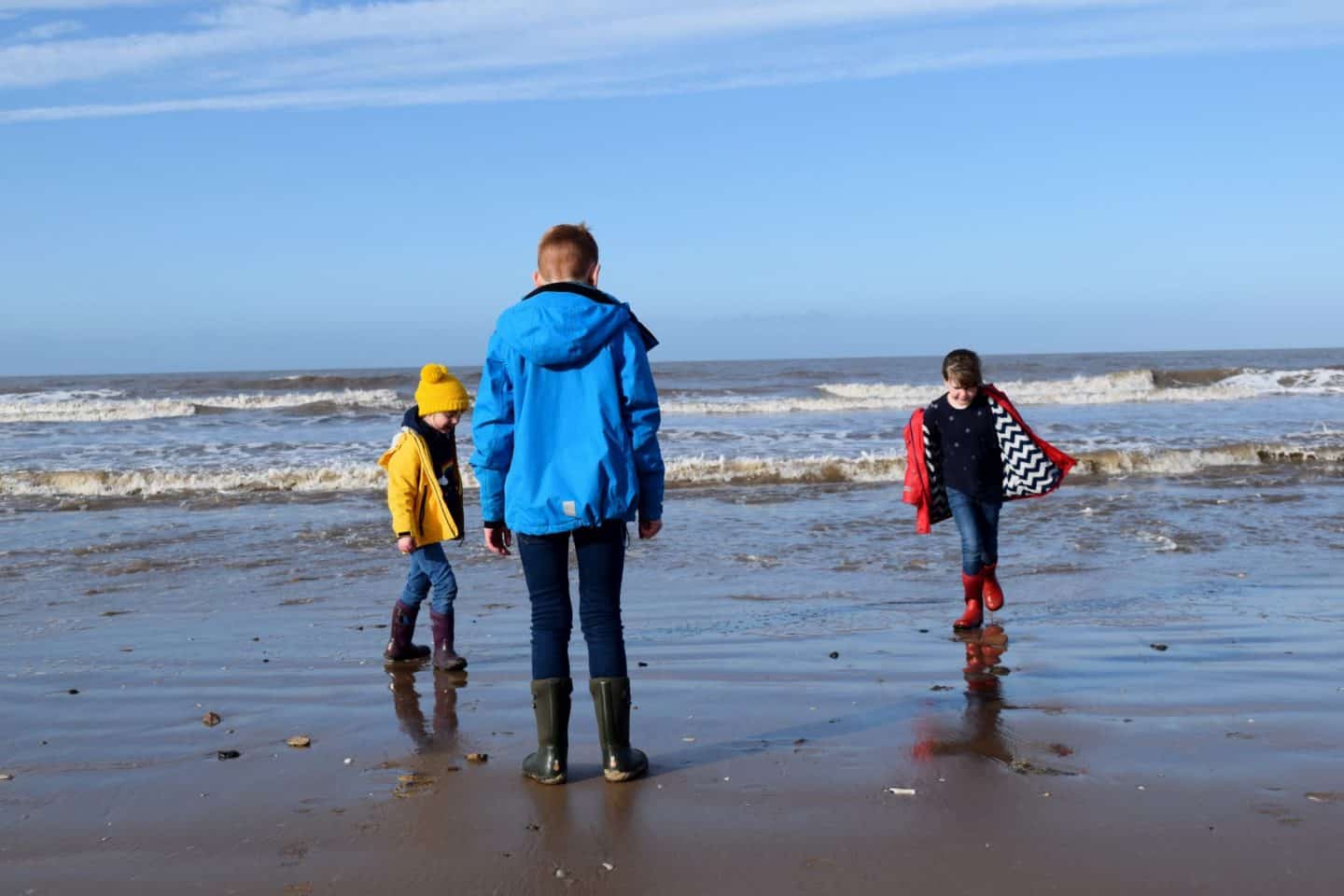 National Trust Formby paddling in the sea