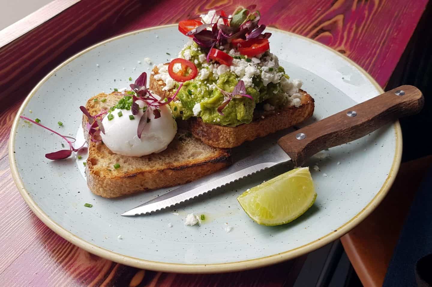 poached egg and avocado on toast at Ezra & Gil