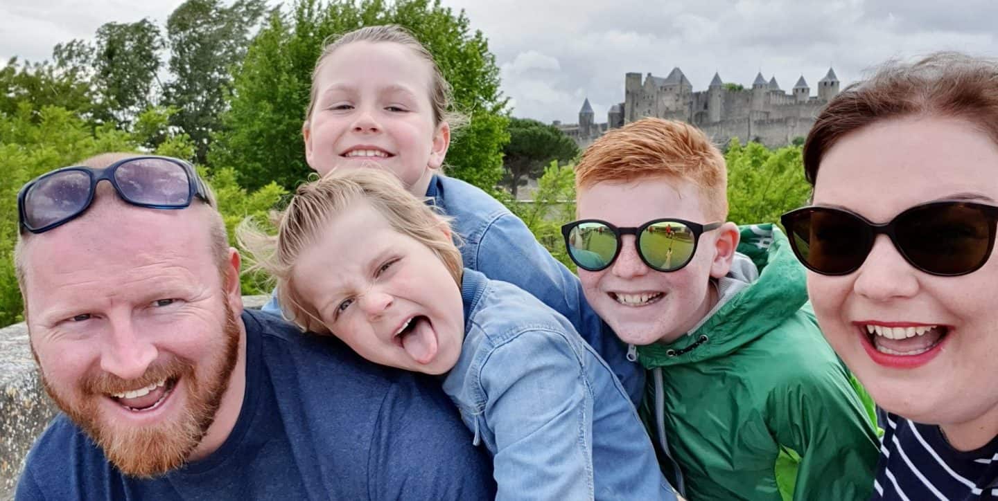 Family of five in front of the castle at Carcassone